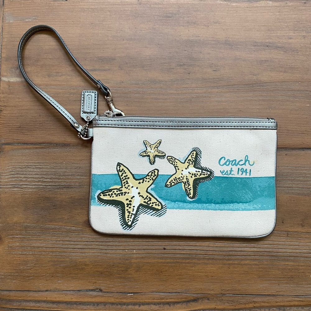 Coach Cream, Blue, and Silver Beach Wristlet Bag